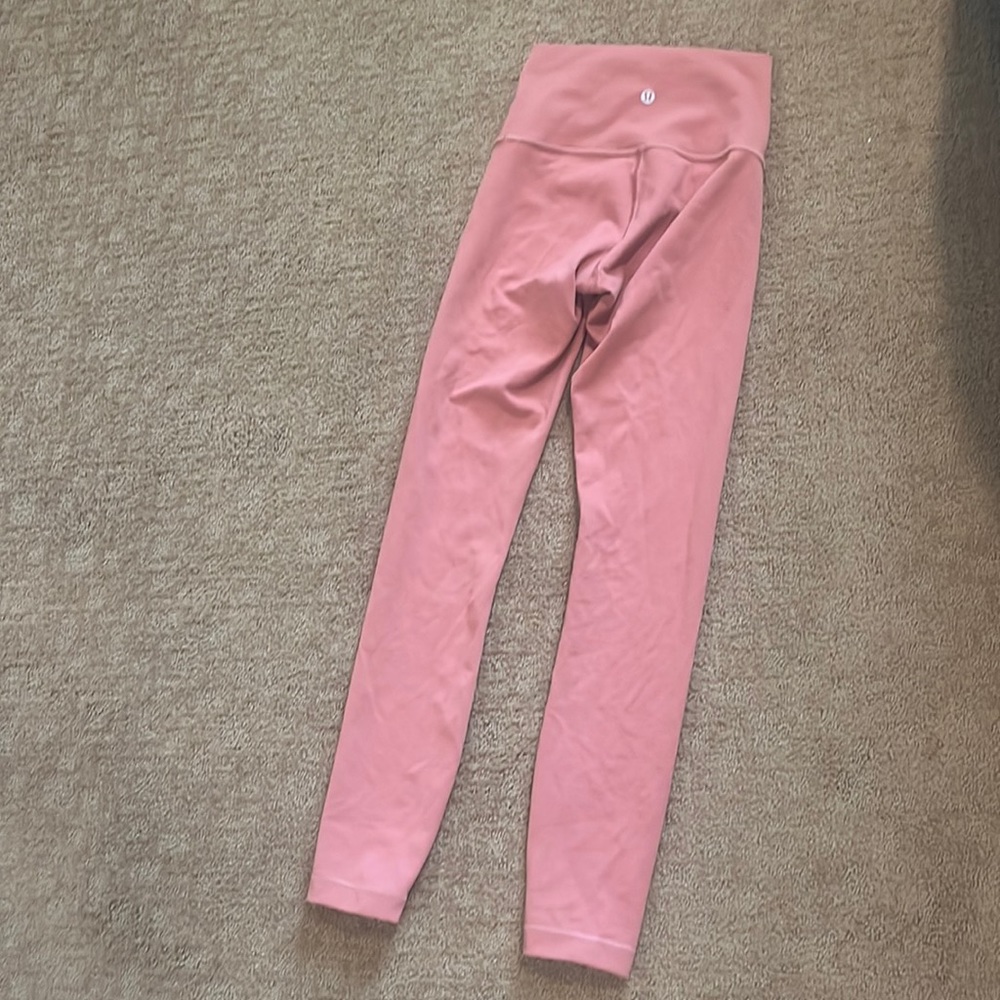 Like new, real Lululemon, beautiful rusty pink color!